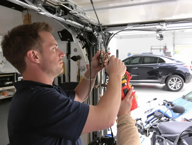 Suffield Garage Door Repair safety certified technician performing cable replacement in Suffield