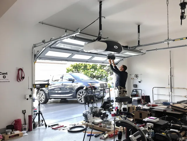 Suffield Garage Door Repair specialist installing smart garage door opener system in Suffield home