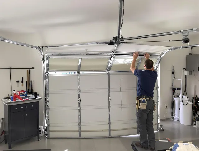 Suffield Garage Door Repair specialist performing precise section replacement on Suffield garage door